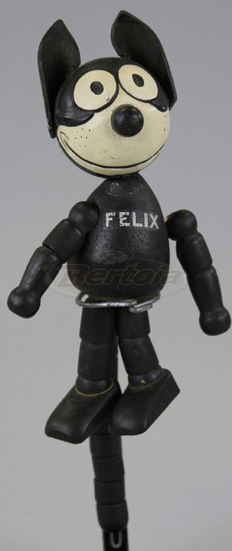 WOODEN JOINTED "FELIX THE CAT" FIGURE: Schoenhut toy with stamp on sole of one foot, "Felix Copyright 1922, 1924 by Pat. Sullivan Pat. Applied For," wooden segment jointed arms, legs and tail with separate wooden torso and head, leather pa
