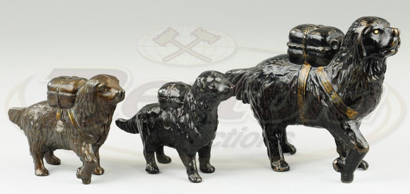 LOT OF ST. BERNARDS WITH PACKS STILL BANKS: A.C. Williams, cast iron, includes large and small St. Bernard examples and retriever with pack, two painted in black, small Bernard in brown. 5 1/4" to 7 3/4" w.
