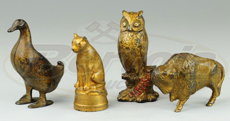 GROUPING OF STILL BANKS: Cast iron, includes a Bison, Duck, Owl on tree branch with lettering and Cat on base, all painted in gold overall. 4 1/4" to 5 1/4" h.
