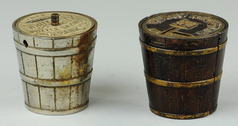 WHITE CITY PUZZLE & PENNY REGISTER BUCKET STILLS: Cast iron, one done in nickel finish, one japanned overall with gold highlights, both embossed in simulated wood sides.