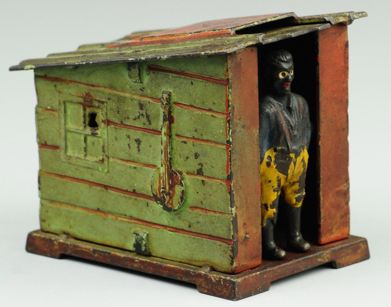 CABIN MECHANICAL BANK: Green color, J & E Stevens Co., designed by Edward L. Morris, Boston, Mass., patented 6/2/1885. Place the coin upon the roof above the man's head, move the handle of the white wash, and the man will b