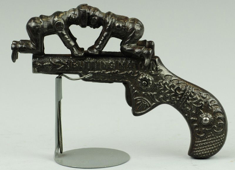 IVES BUTTING MATCH ANIMATED TOY CAP GUN: C. 1885, cast iron, japanned, depicts figures butting heads which allow strike of cap. 5"long.