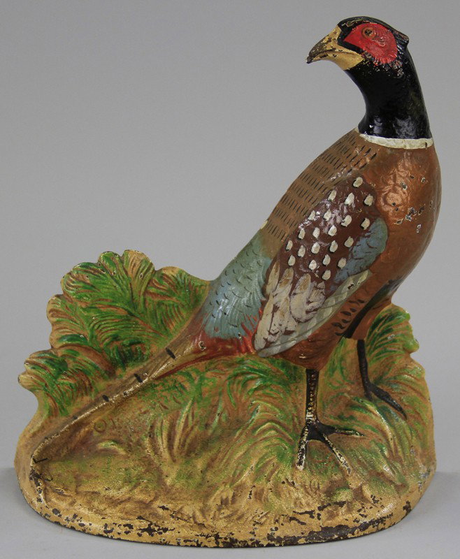 HUBLEY PHEASANT DOORSTOP: Hubley, #458, signed "© Fred Everett," finely detailed, hand painted depiction of pheasant in underbrush. 7 1/4" w. x 8 1/4" h.