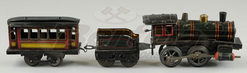 KARL BUB TRAIN SET: O gauge, lithographed tin, includes clockwork 0-4-0 engine and tender, together with four wheel passenger car. 14 1/4" l.