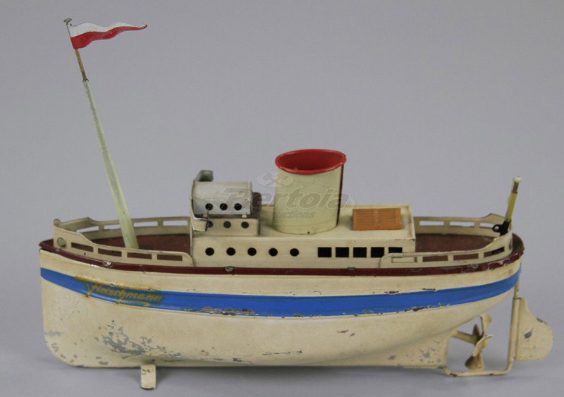 FLEISCHMANN OCEANLINER: Clockwork driven, small hand painted and lithographed tin oceanliner with pilot house, upper deck level, single mast and funnel. 7 1/2" l.