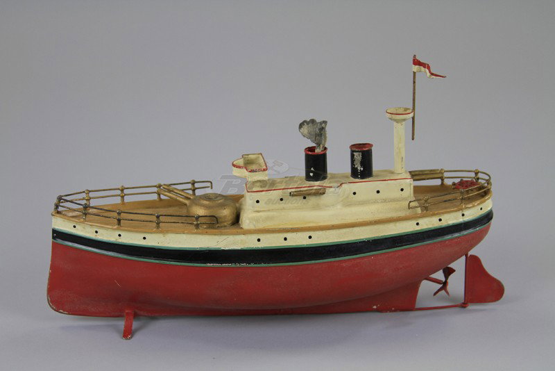 FLEISCHMANN TORPEDO BOAT: Germany, hand painted, red hull, railed deck, two funnels, clockwork mechanism, observation mast, pilot's house, guns at bow. 12" l.