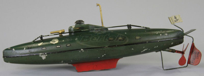 MARKLIN SUBMARINE: C. 1930's, Germany, painted in dark green, red rudder and weight, clockwork driven, railed deck and gun facing bow. 10" l.