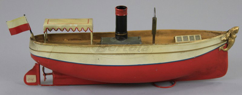 UEBELACKER RIVER BOAT: Hand painted, features canopy covered stern, single funnel, clockwork mechanism, typical bow figure. 10" l.