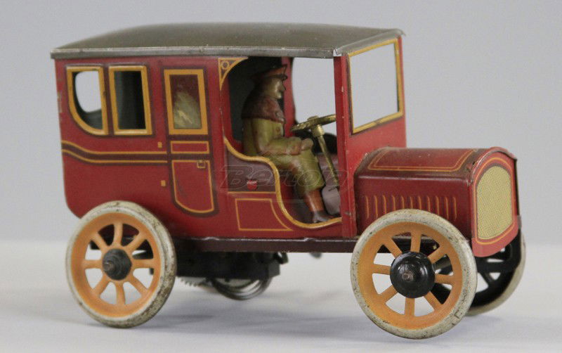 BING LIMOUSINE: Germany, lithographed tin, classic sedan with seated driver, brown body, olive roof, key wind operated. 5 1/4" l.