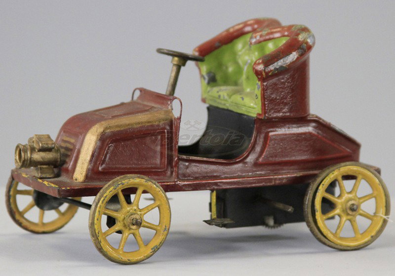 BING "DE DION" RUNABOUT: Germany, c. 1904, hand painted tin open tourer, two seater w/cast head lamp, embossed seating, spoke wheels, rubber tires, clockwork driven. 6 1/2" l.