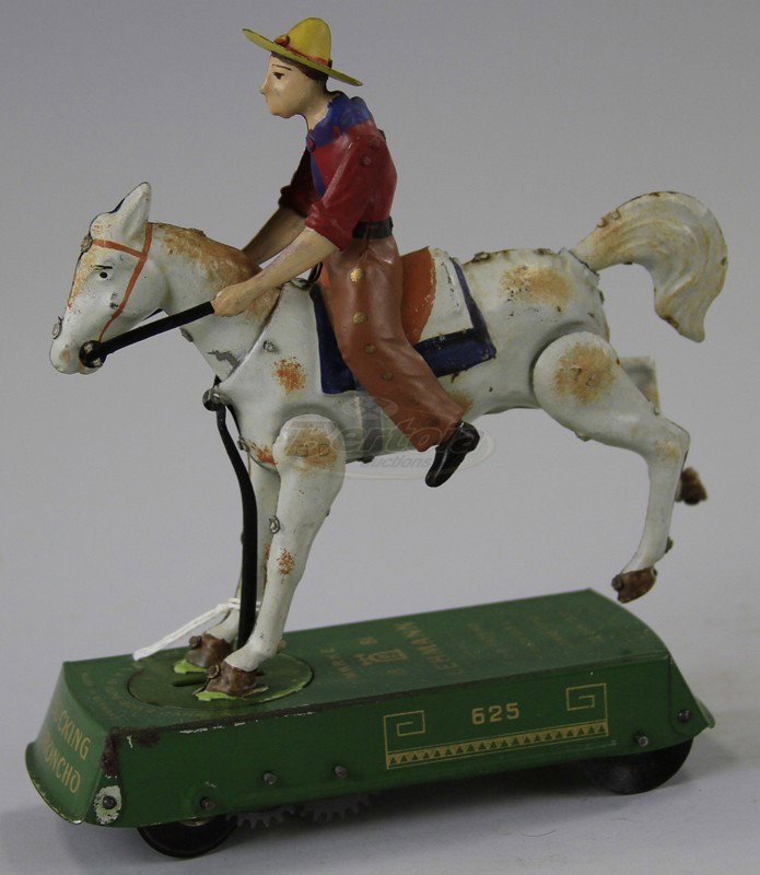LEHMANN WILD WEST BUCKING BRONCO: Germany, lithographed and hand pained tin, depicts cowboy mounted on white horse, clockwork causes amusing flipping action. 7" l.