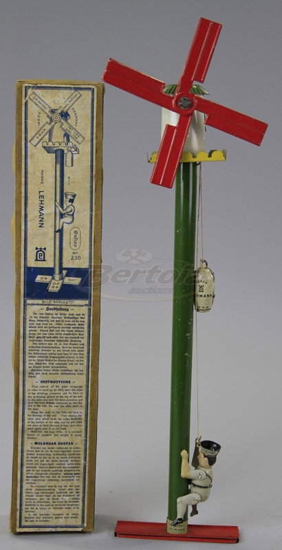 LEHMANN GUSTAF THE MILLER: Germany, boxed, example, lithographed tin, figure able to climb shaft of tall windmill, large weight on head allows gravity travel and spinning blades. 17"high.