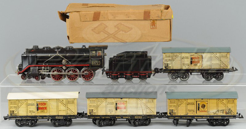 MARKLIN GR 66/12920 ENGINE AND FOUR BING BOX CARS: O gauge, includes the 4-6-0 loco with tender, and four lithographed tin box cars with simulated wood sides and advertising on doors. Cars 7 1/2" l.