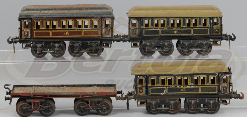THREE CARETTE PASSENGERS CARS AND BING FLAT CAR: Matching cars in brown lithograph bodies, opening doors, 1 gauge, Bing flat car, poor condition added to lot Cars 7 1/2"