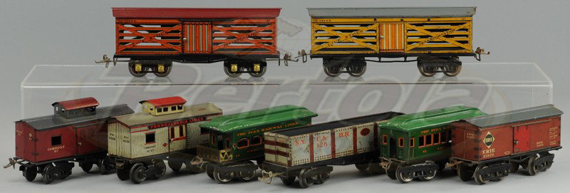 GROUPING OF IVES TRAINS: O gauge lot, includes two 9" stock cars and gondola, 6 1/4" box car and two cabooses, and 61 and 68 passenger set cars.