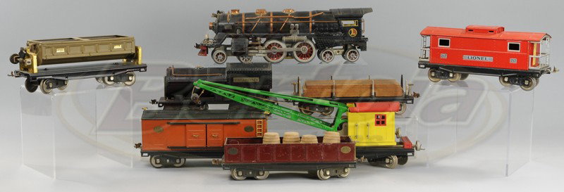 LIONEL 400E WITH FREIGHT CARS: Standard gauge, includes the 4-4-4 400E in black, copper stamping together with 212 gondola, 218 side dumping car, 219 crane, 214 box car, 211 flat car and 217 caboose, cars were added to loco to make