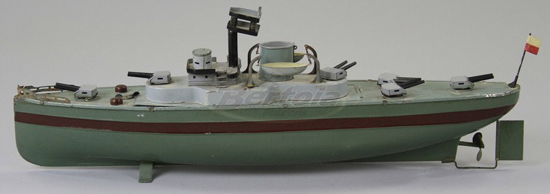 FLEISCHMANN DESTROYER: Tin war ship done in green with brown hull band, features multiple guns on open deck, pilot's observation tower, lifeboats, single funnel, clockwork driven. 19" l.