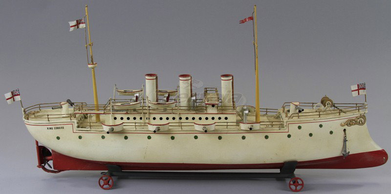 BING "KING EDWARD" GUNBOAT: Germany, early 1900's, clockwork version, hand painted tin, done in white with red band hull and extensive red trim, this large scale battleship features four guns on each side, three funnels, masts a