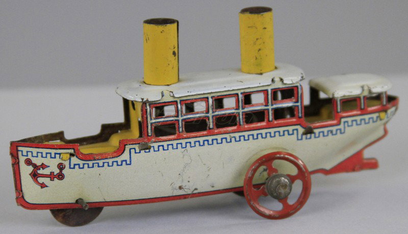FISCHER PASSENGER BOAT PENNY TOY: Germany, lithographed tin, white hull, yellow stacks, upper deck cabin, red spoke wheels. 4 1/4" l.