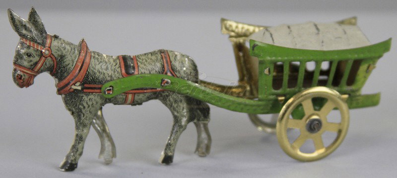 DONKEY WAGON PENNY TOY: Germany, attributed to Fischer, lithographed tin, slat side open cart, drawn by litho donkey. 4 1/2" l.