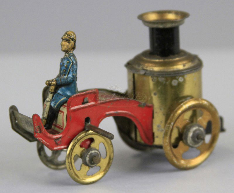 FISCHER FIRE ENGINE PENNY TOY: Germany, lithographed tin, seated fireman, boiler on open cart, early pumper version. 3 1/4" l.