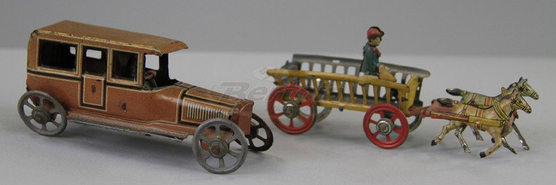 FISCHER SALOON AND HORSEDRAWN CART PENNY TOYS: Lithographed tin, brown colors, open windows, spoke wheels, together with open stake cart, horse drawn with seated driver. 4" long