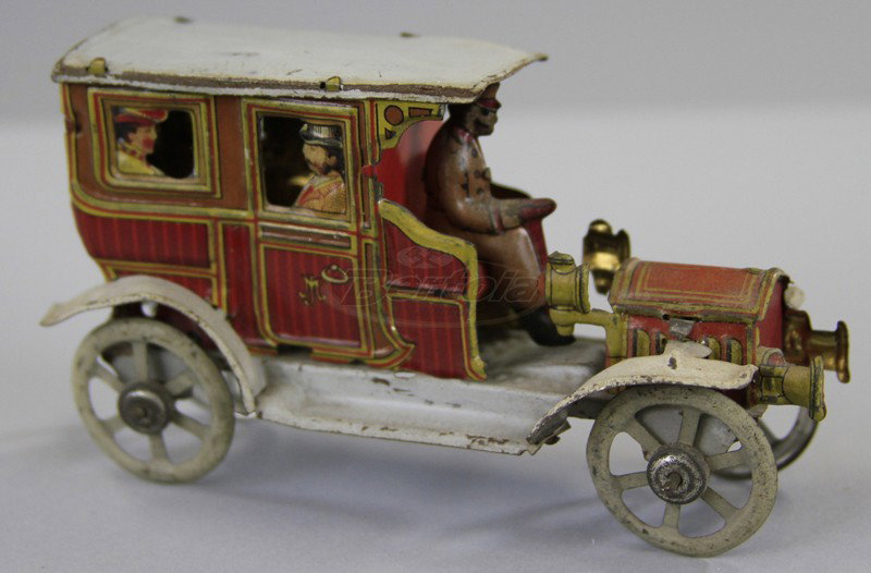MEIER LIMOUSINE PENNY TOY: Germany, lithographed tin, die cut passengers at window, head and side lanterns, full fenders, seated chauffer. 4 1/4" l.