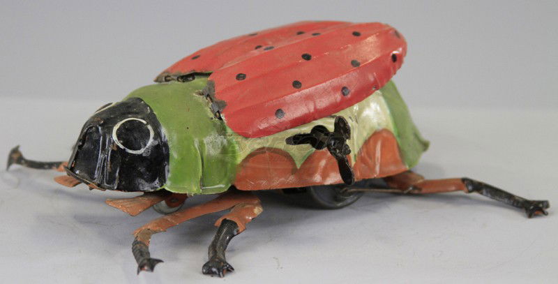 GUNTHERMANN BEETLE: Germany, hand painted tin, features flapping wings, six legs, very colorful, clockwork activated. 6" l.