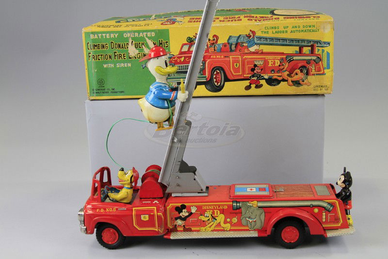 BOXED CLIMBING DONALD ON FIRE ENGINE: Copy. Walt Disney Prod., Linemar, Japan, battery operated and friction powered, heavy tinplate open fire truck, great action allows Donald to climb up and down ladder, Pluto driven, Mickey rider. 18"