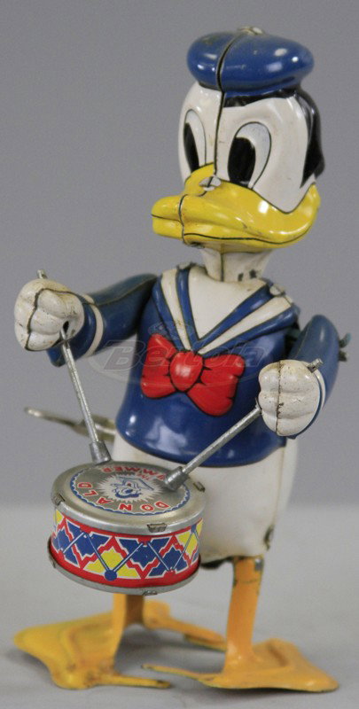 DONALD DUCK WALKING DRUMMER: Copy. Walt Disney Prod., Linemar, Japan, lithographed tin, depicts Donald with drum stick in hand, able to tap drum head and walk when key wind is operated. 8" h.