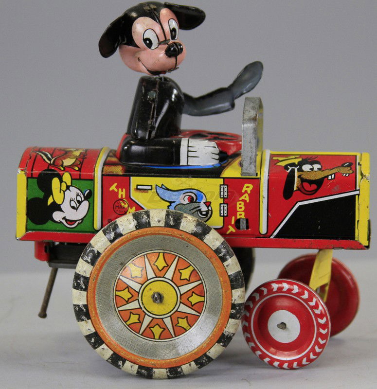 MICKEY MOUSE DIPSY CAR: Linemar, Japan, lithographed tin, colorful graphics overall, depicts Mickey seated in open auto with nodding head, clockwork driven. 5 1/4" h.