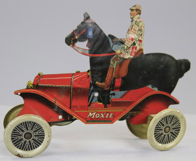 MOXIE ADVERTISING HORSE CAR: C. 1917, difficult red version, great die-cut in tin lithography, classic Moxie auto with horse and rider in body. 8 1/2" l.