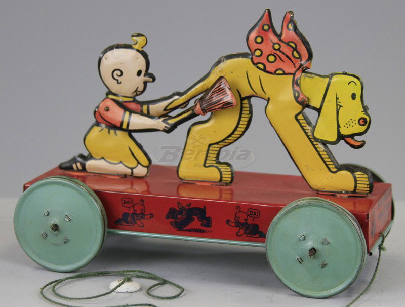 BUTTERCUP 'N SPARE RIBS PUSH TOY: Nifty, lithographed tin, articulated action, broom and head move up and down when pulled along floor, colorful figures, red platform with graphics on sides. 7 1/2" l.