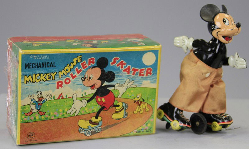BOXED MICKEY MOUSE ROLLER SKATER: Linemar, Japan, copy. Walt Disney Prod., lithographed tin, wears silk pants, posed in skating form, key wind operated. 6" h.
