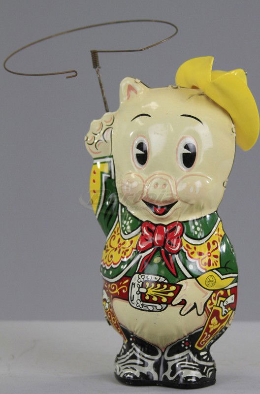 MARX PORKY PIG IN COWBOY OUTFIT: C. 1949, lithographed tin, depicted in yellow cowboy hat and lasso in hand, key wind operated. 8" h.