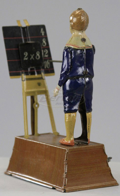 THE LITTLE CALCULATOR: Tipp & Co., Germany, lithographed tin, depicts school boy using pointer at chalkboard and seemingly able to solve simple math problems, clockwork activated. 7" h.