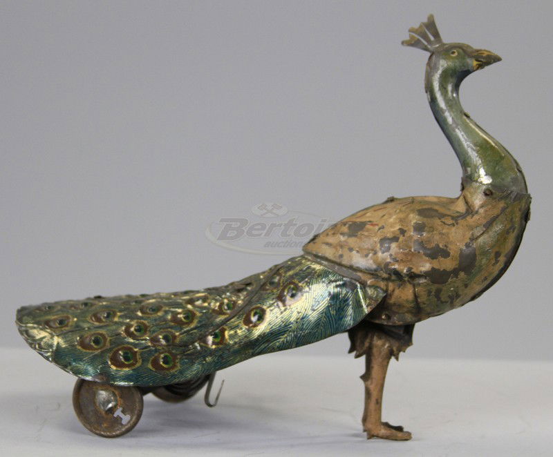 PAO PAO, WALKING PEACOCK: Hans Eberl,Germany, lithographed tin, clockwork toy peacock with walking motions, early version. 9" l.