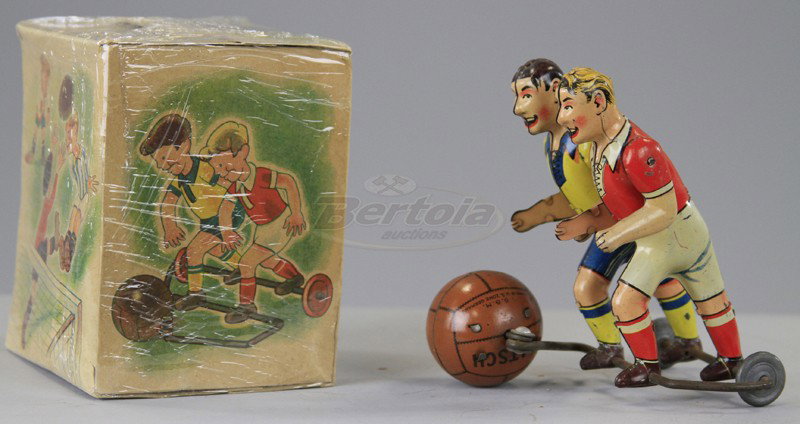 TWO SOCCER PLAYERS WITH BALLS: Boxed example, US Zone, Germany, depicts opposing team players chasing "Matsch" ball, both on wire frame support, key wind operated. 4 1/4" h.