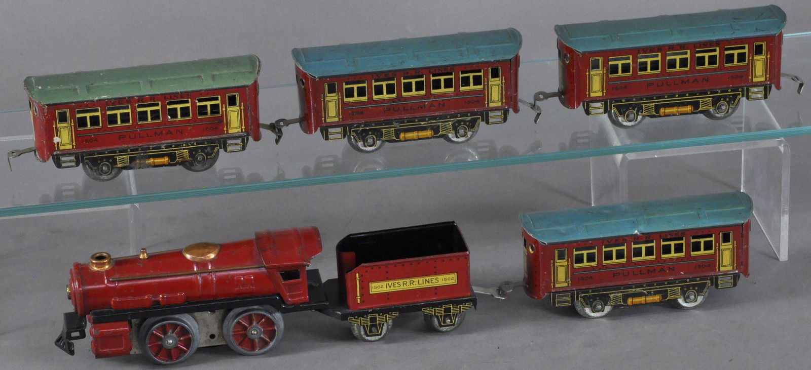 LIONEL JUNIOR IVES TRANSITION SET: 167. LIONEL JUNIOR IVES TRANSITION SET | O gauge, wind-up. | Loco 6" l. | (VG Cond.) | $200 - $400