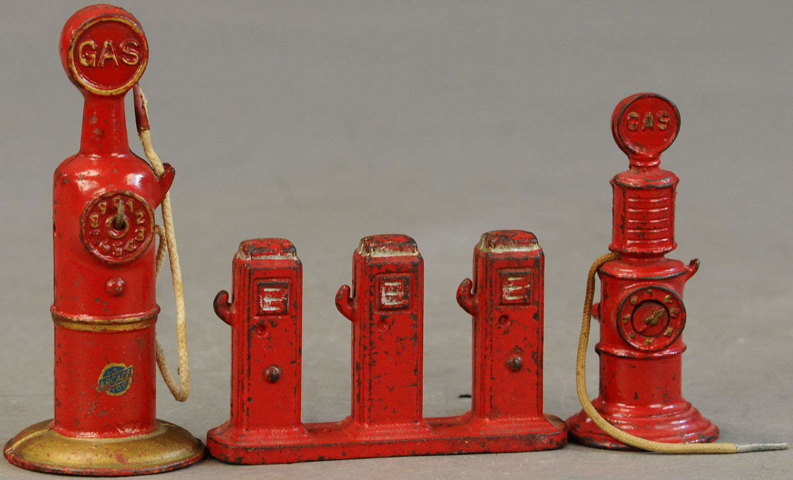 THREE CAST IRON GAS PUMPS (1 of 3)