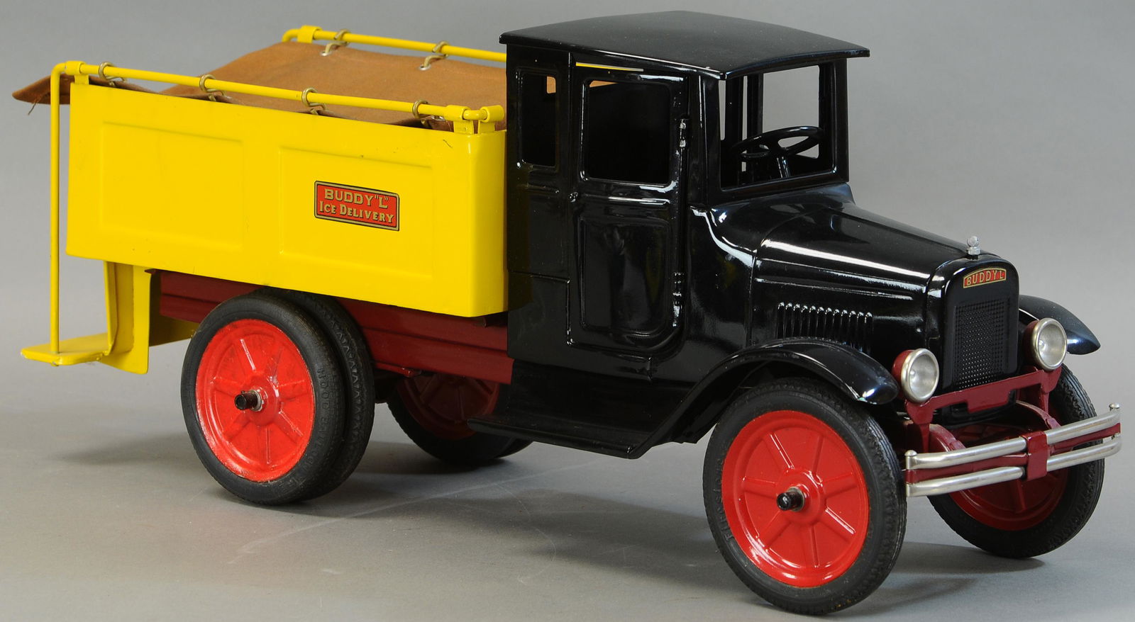 BUDDY L PRESSURIZED SPRINKLER TRUCK: 660. BUDDY L PRESSURIZED SPRINKLER TRUCK | 25" l. | Restored with some replacement pieces or possibly a Contemporary Example. | $400 - $800