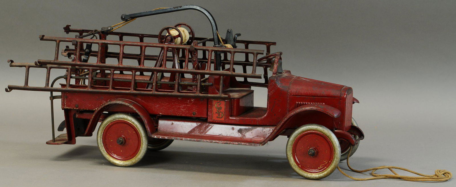 BUDDY L HOOK & LADDER TRUCK: 665. BUDDY L HOOK & LADDER TRUCK | 26" l. | All Original Condition. | $400 - $800