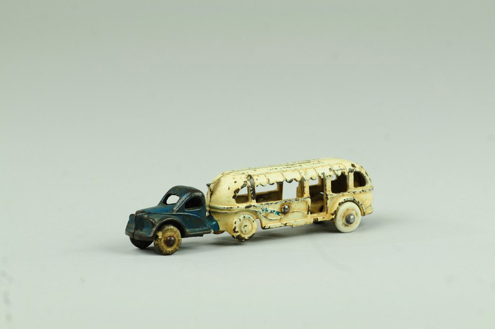 ARCADE 1934 CHICAGO CENTURY OF PROGRESS BUS: Cast iron, smallest of series and souvenir example from the World's Fair, one piece casting, painted in blue and white. 5 1/2" l.