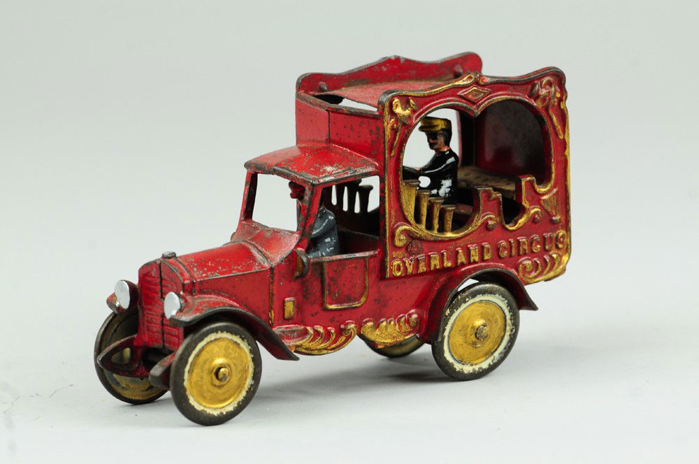 CALIOPE TRUCK: Kenton, cast iron circus toy depiction, well cast details of seated musician in open side body with cast organ pipes, very ornate, embossed sides. 9" l.
