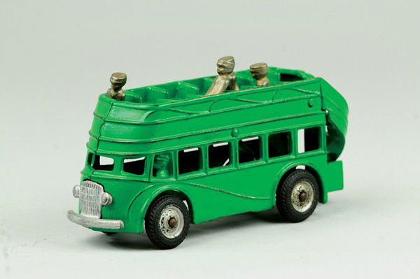 ARCADE DOUBLE DECKER BUS: Cast iron, painted in green overall, features nickel grille, upper level seating and rear stairs, black rubber tires. 7 3/4" l.