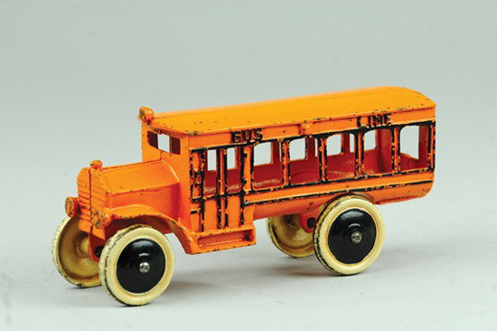 DENT "BUS LINE" BUS: Cast iron, painted in orange overall, embossed "BUS LINE" on sides, nice detail to door casting, disc wheels painted silver. 8 1/2" l.