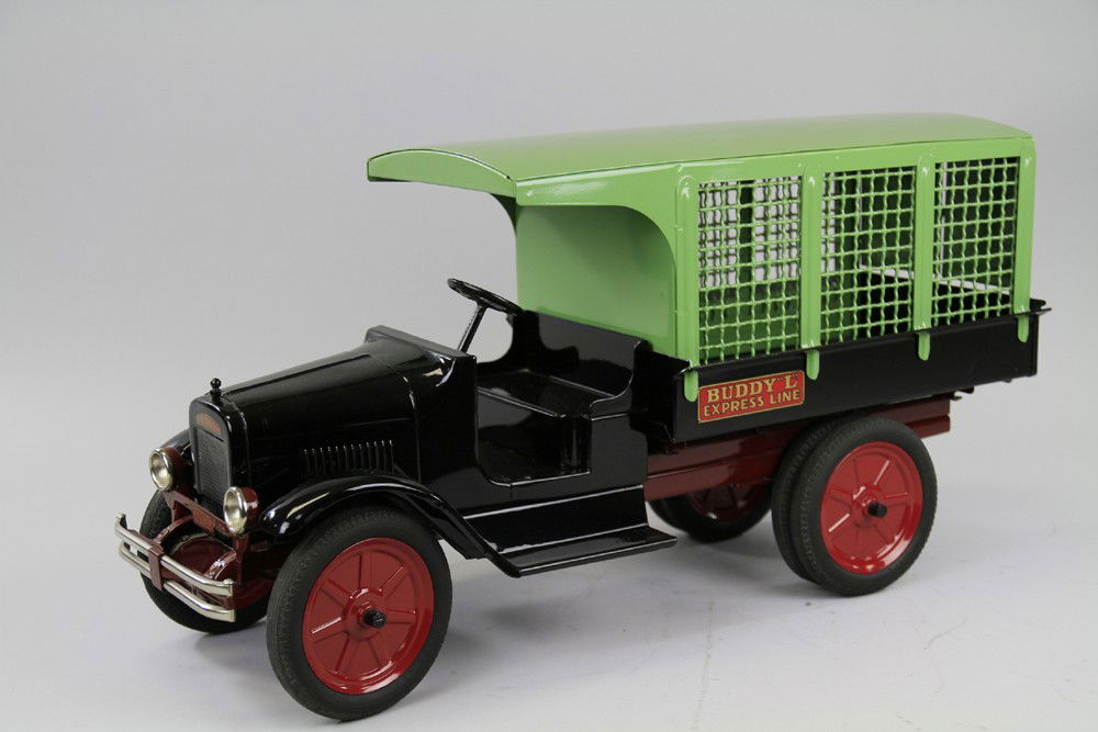BUDDY 'L' EXPRESS LINE TRUCK: C. 1932, professional restoration to an original truck, done in proper colors, black open seat cab, mesh side removable van body painted in green, opening tailgate and van doors, rubber tires, disc wh
