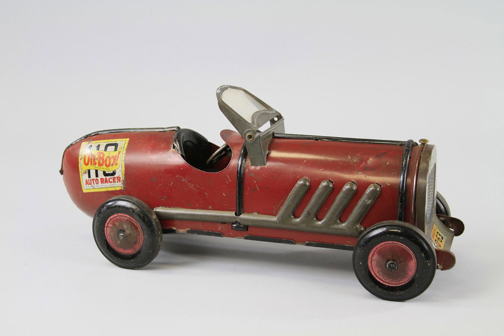 OH-BOY AUTO RACER: C. 1936, large scale toy kiddies racer, painted in red, embossed pipes on sides, decal on rear, sides and radiator. 19" l.