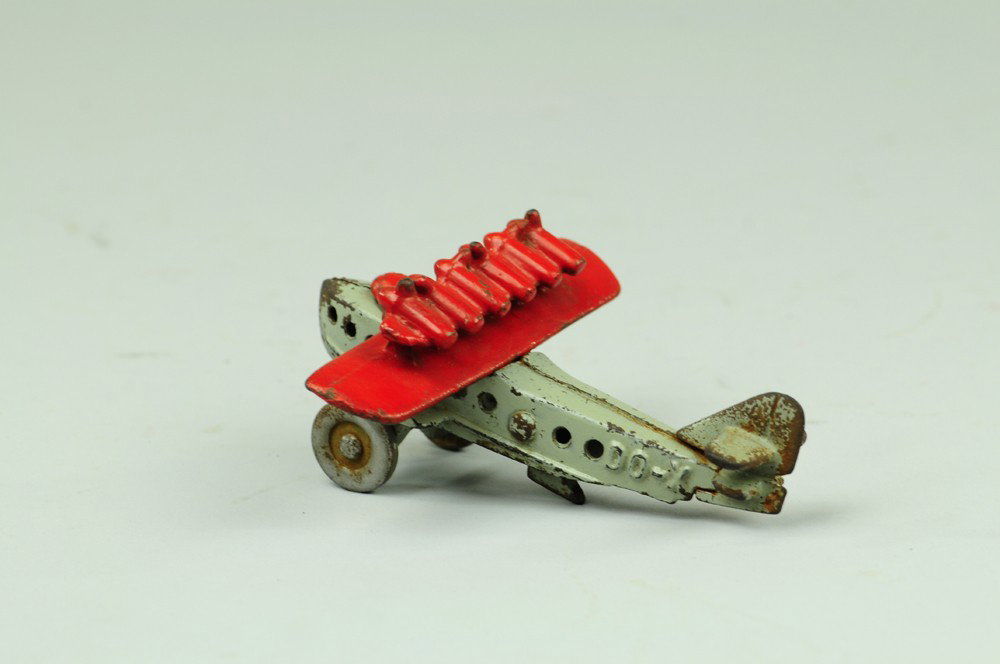 HUBLEY DO-X AIRPLANE: C. mid-1930's, cast iron, small size, scarce example, painted in red wings with cast motors, propellers and grey fuselage embossed "DO-X," nickel disc wheels. 4" wing.
