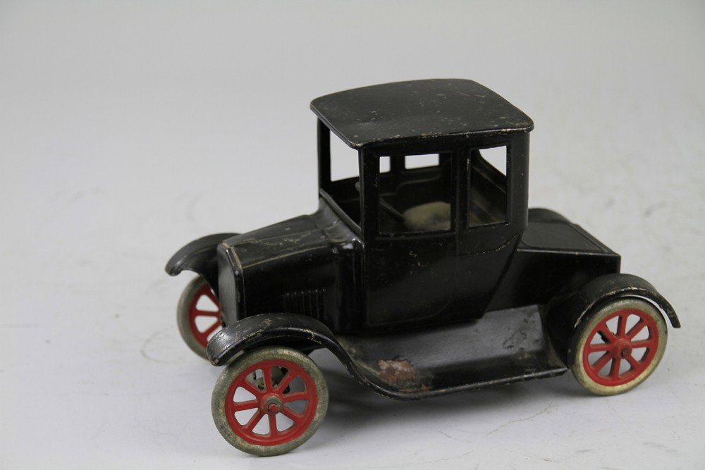 BUDDY 'L' FLIVVER COUPE: Pressed steel, painted in black overall, aluminum spoke wheels, partial label on bottom. 12" l.